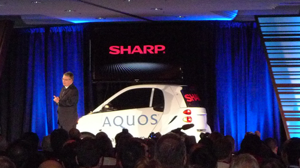 Sharp 80-inch TV on car at CES 2012.